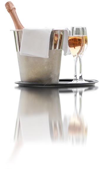 Champagne in bucket with two poured glasses