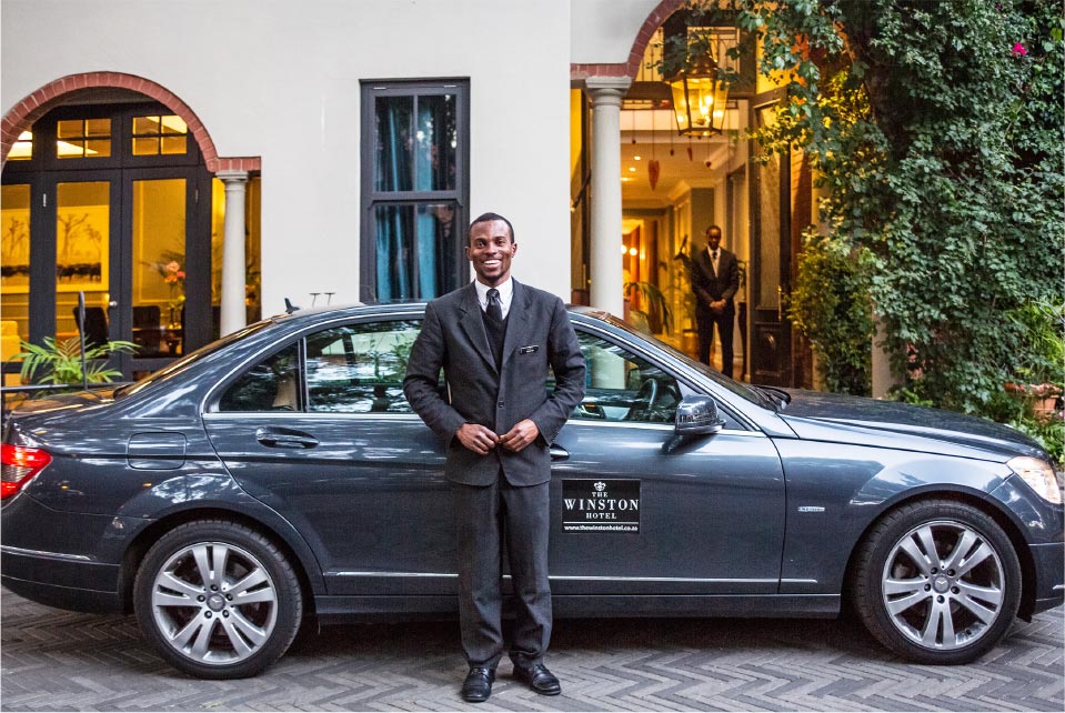 The Winston Hotel driver waiting in front of his Mercedes The Winston Hotel driver waiting in front of his Mercedes